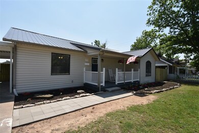 Ranch-style house featuring a front yard and pavin
