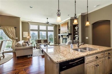 High ceilings and hardwoods enlarge the feel and f