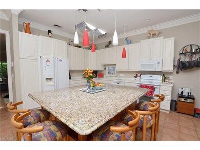 Updated kitchen features huge granite gathering is