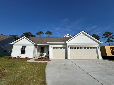 Ranch-style house featuring a garage, driveway, a 