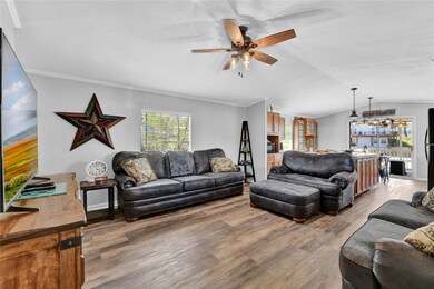 Family room with ample seating. Laminate flooring.