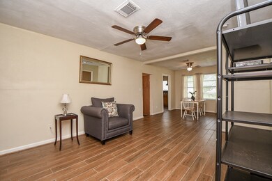 Beautiful wood floors throughout the living area and ceiling fans as well.