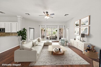  Floor to ceiling windows bring the outside in and maintain views of the pool and backyard.  Virtually Staged Photo.