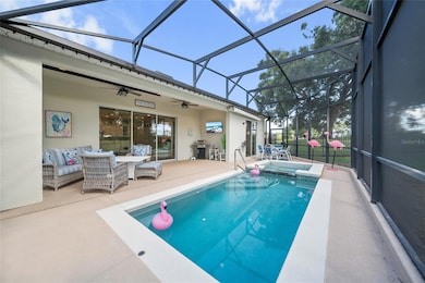 Enjoy golf course views from your screened-in lanai with private pool, spa, and outdoor TV setup.