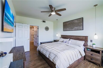 Bedroom featuring wood finished floors and a ceiling fan
