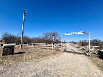 View of yard with a rural view and fence