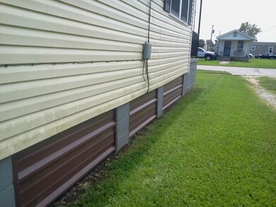 HOME NORTHSIDE SKIRTING IS ALUM TO AID IN INSULATING OF HOME.