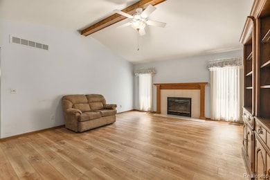Volumnizing living room w/luxury vinyl flooring throughout