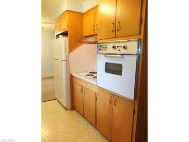 Kitchen with countertop range and wall oven.