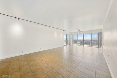 Spare room featuring light tile patterned floors a