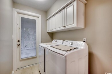Laundry area featuring cabinets, independent washe