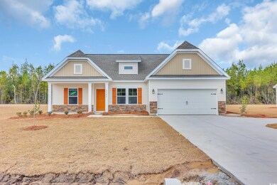 Craftsman-style home with a front lawn, stone sidi