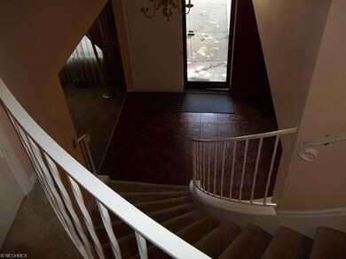 Double entry door with large parquet foyer and cur
