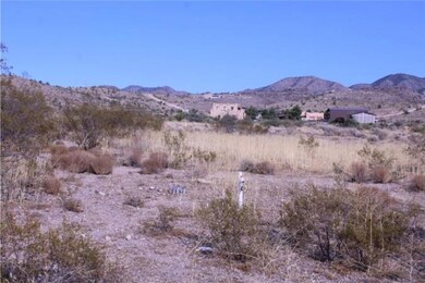 View of mountain backdrop with rural landscape