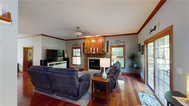 Family Room with Gorgeous Flooring, Crown Molding,