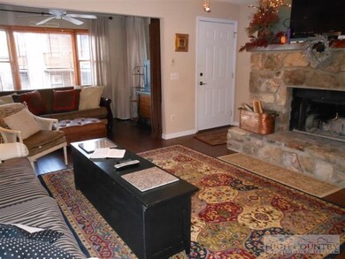 Stone Fireplace: The handsome stone fireplace is t