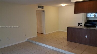 VIEW OF THE KITCHEN & DOOR TO THE BEDROOMS