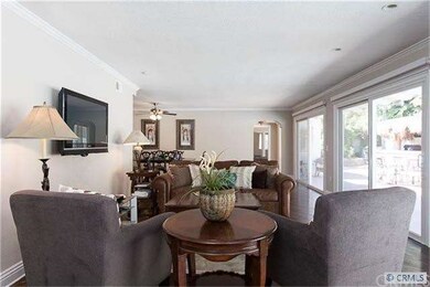 Warm and welcoming living room with view of the po