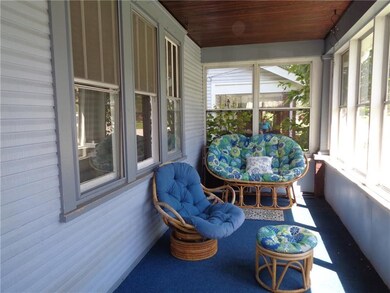 Enclosed front porch with wood planked ceiling-gre