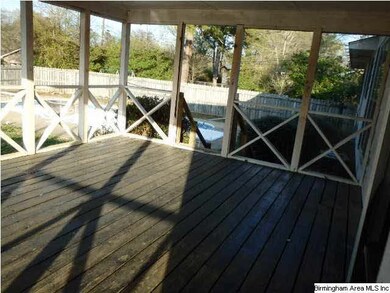 Screened porch overlooking pool