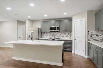 Kitchen with appliances with stainless steel finis