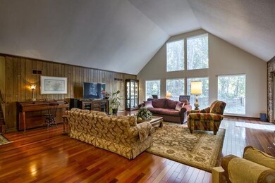 Large great room with vaulted ceilings overlooking