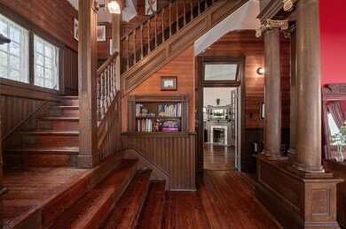 Stairway with wood walls, plenty of natural light