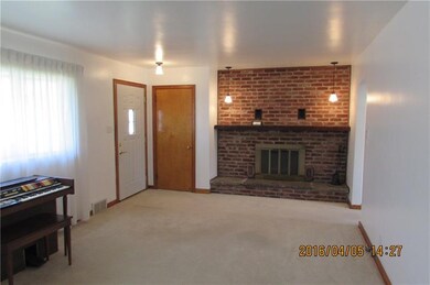 Living room with cozy gas log fireplace.