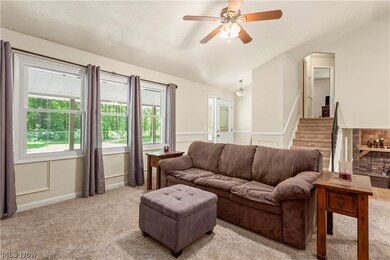 Spacious living room with vaulted ceiling and plenty of natural light.