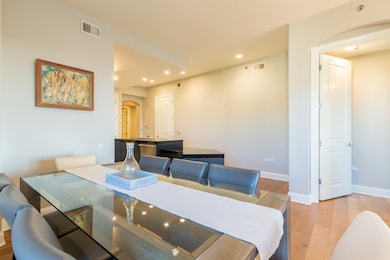 Dining space with light hardwood / wood-style floo