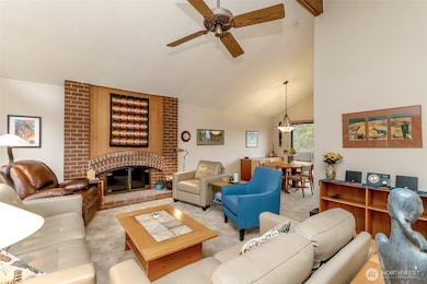 Sun-Filled Living Room—a perfect blend of warmth and space with a cozy wood burning fireplace.