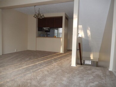 The dining room has an updated chandelier.