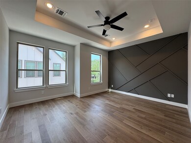 Primary bedroom with plenty of natural light