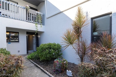Doorway to property with stucco siding