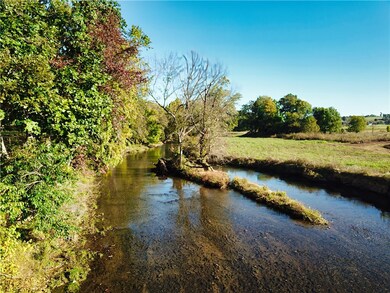 Osage Creek is a year round stream and borders the back of the property. The area along the creek is in a 100 year flood zone.