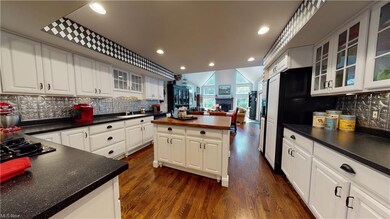 Updated kitchen includes counters, back splash, co