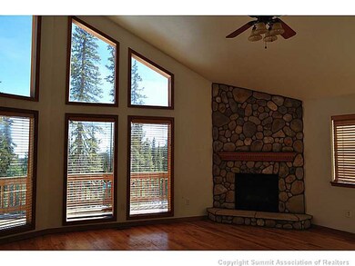 Living Room. The stone fireplace adds a warm touch