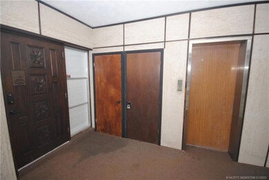 Elevator, Storage Room and Front Door