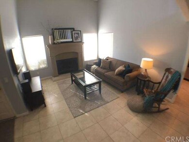 Tiled flooring at living room with vaulted ceiling