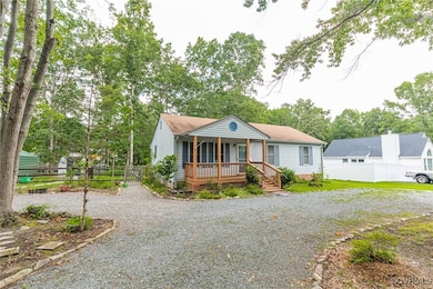 View of front of home with covered porch, driveway