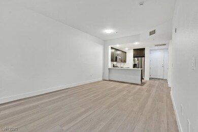 Unfurnished living room with light wood-type floor