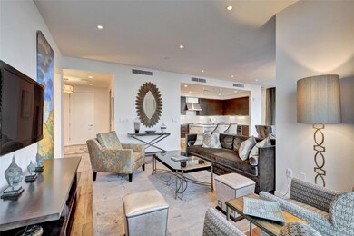 Living room featuring visible vents, recessed lig