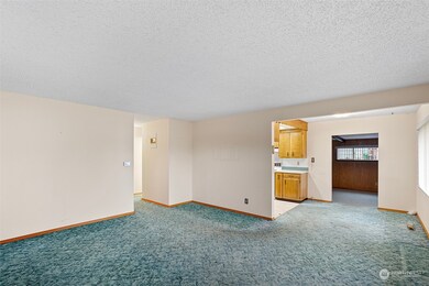 The living room dining and bonus room all flow together in this home.