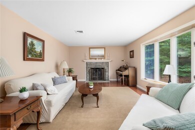 Spacious living room with bay window and fireplace