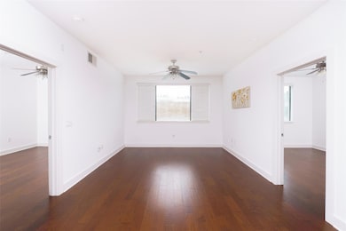 Unfurnished room featuring a ceiling fan, healthy