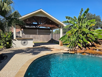Outdoor kitchen with Bull Grill, Granite Countertops, sink, 2 ceiling fans (Fans and exterior base just updated 10/31/2025)