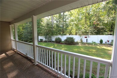Front porch View of yard and flower bed.