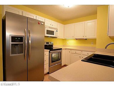 Kitchen. This Stainless Steel SXS refrigerator is included with this Condo! The Range is smooth top and self cleaning too!