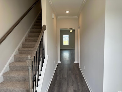 Stairs with baseboards, ornamental molding, a ceiling fan, recessed lighting, and wood finished floors