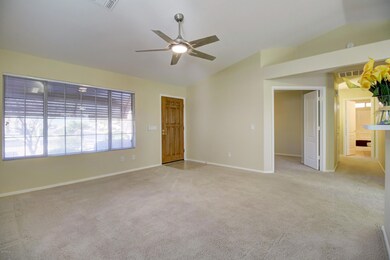 Living Room opens to Den and Kitchen